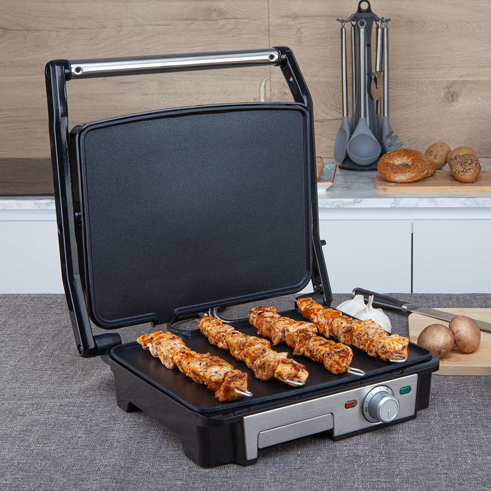 Gril multifonction Orbegozo 4560 - Cuisinière sans huile d'une puissance de 2200 W - Surface antiadhésive - Plaques pliantes à 180º - Thermostat réglable et bac de récupération des sauces